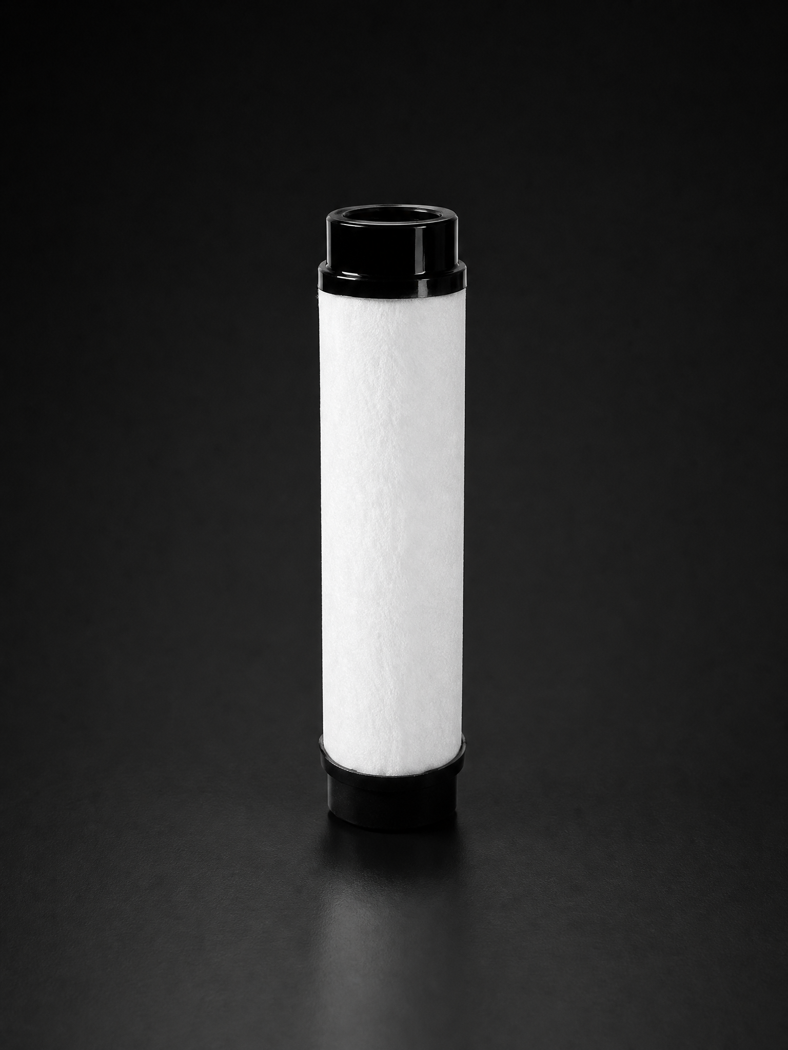 RF-AC vapour adsorption cartridge with activated carbon fill and black end caps for compressed air oil vapour removal | R+F FilterElements